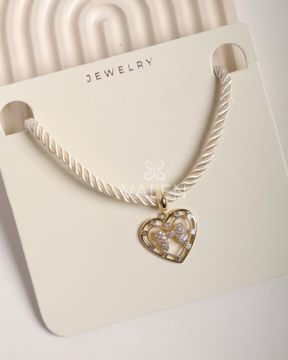 Collar corazón moño